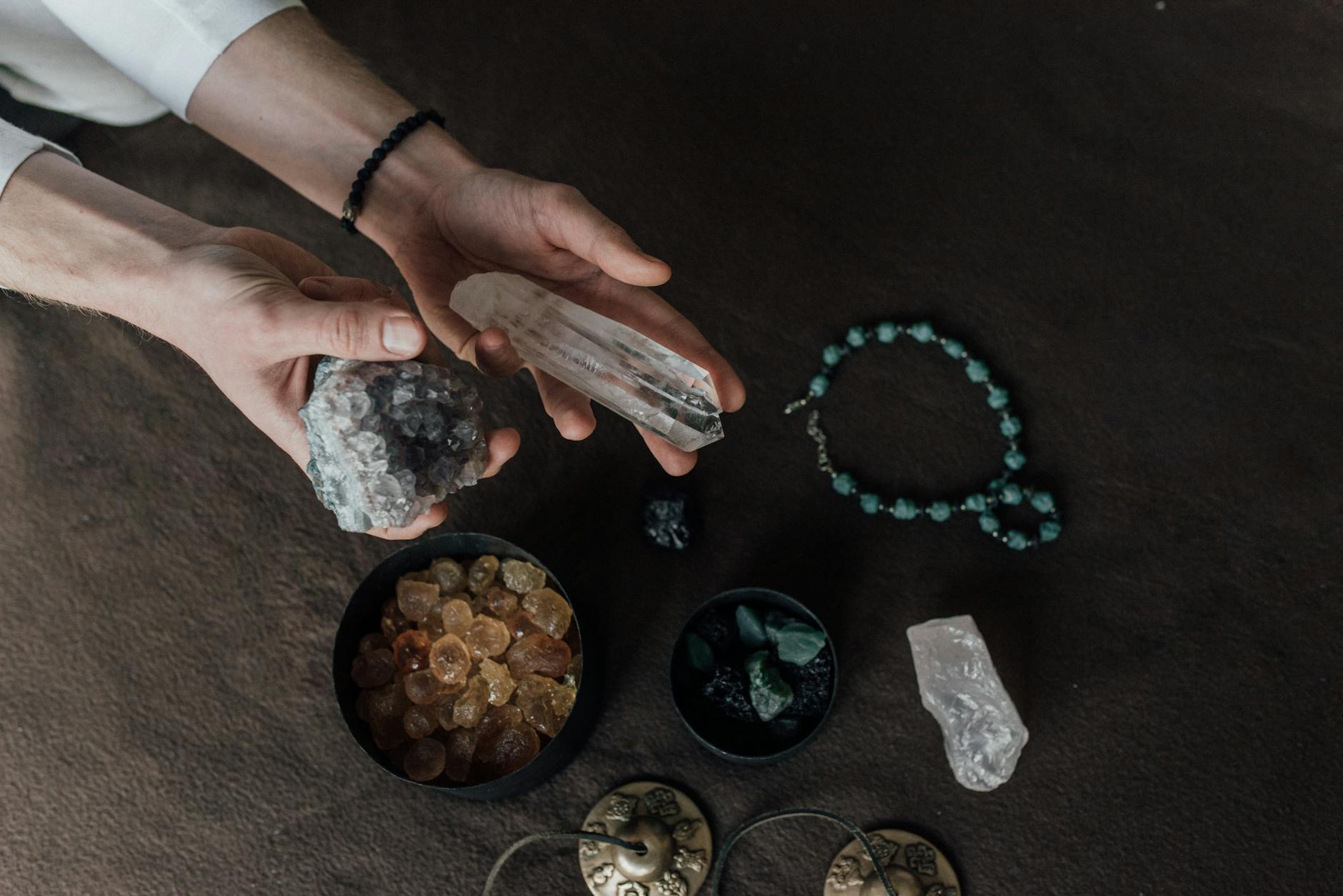 a person holding healing crystals